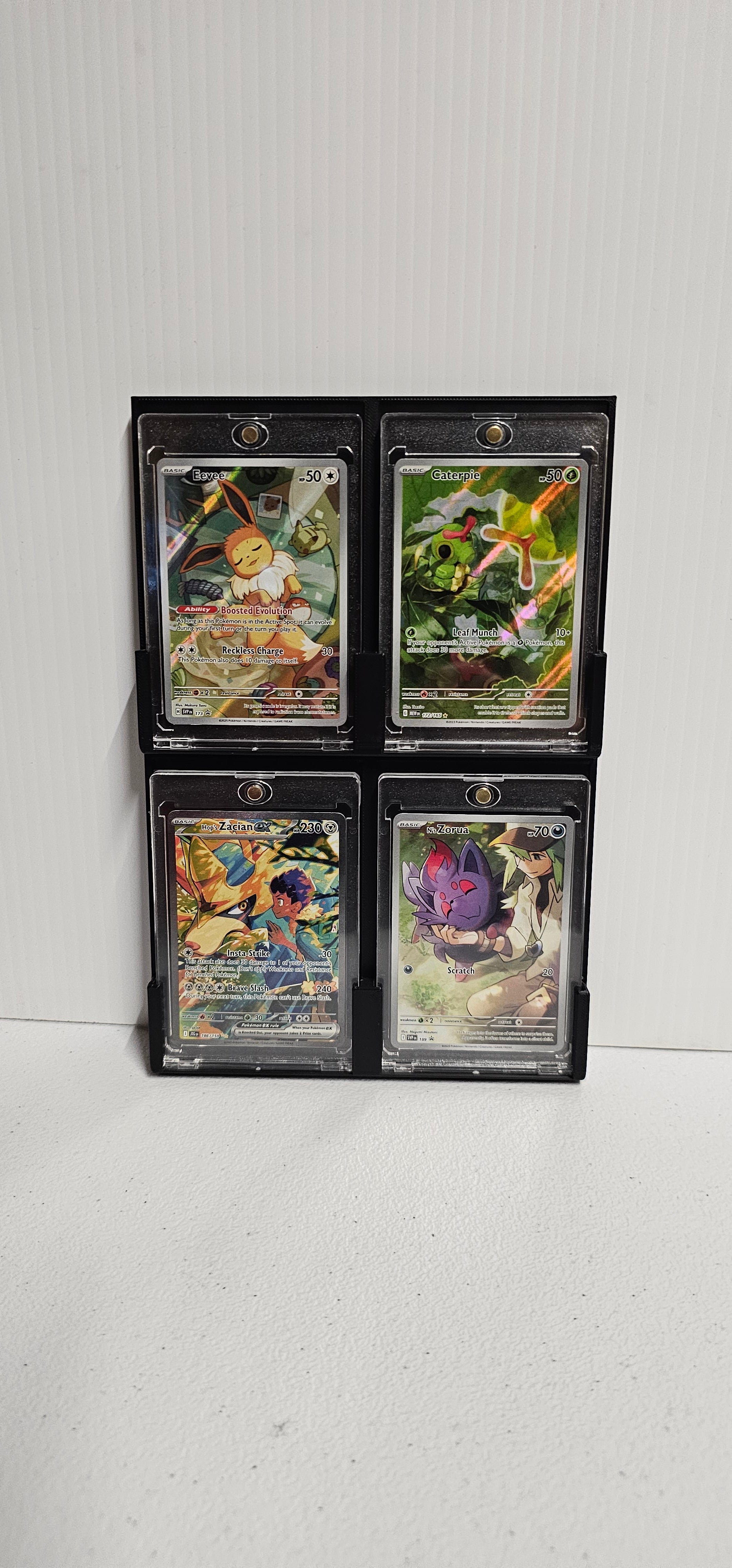 pokemon card display frame & w/ (4) PSA Graded Pokemon Card Openings-Black Design  1x Display Frame (front and rear) 1x Card Sleeve 4x Metals screws to fix together 2x Metal Feet This item and all other items on our store are dispatched from the UK Cool ways to display pokemon